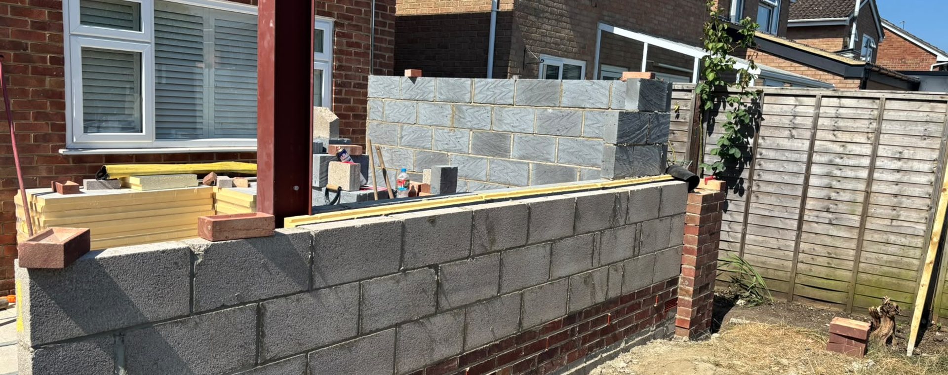 Blockwork extension and structural steel frame under construction