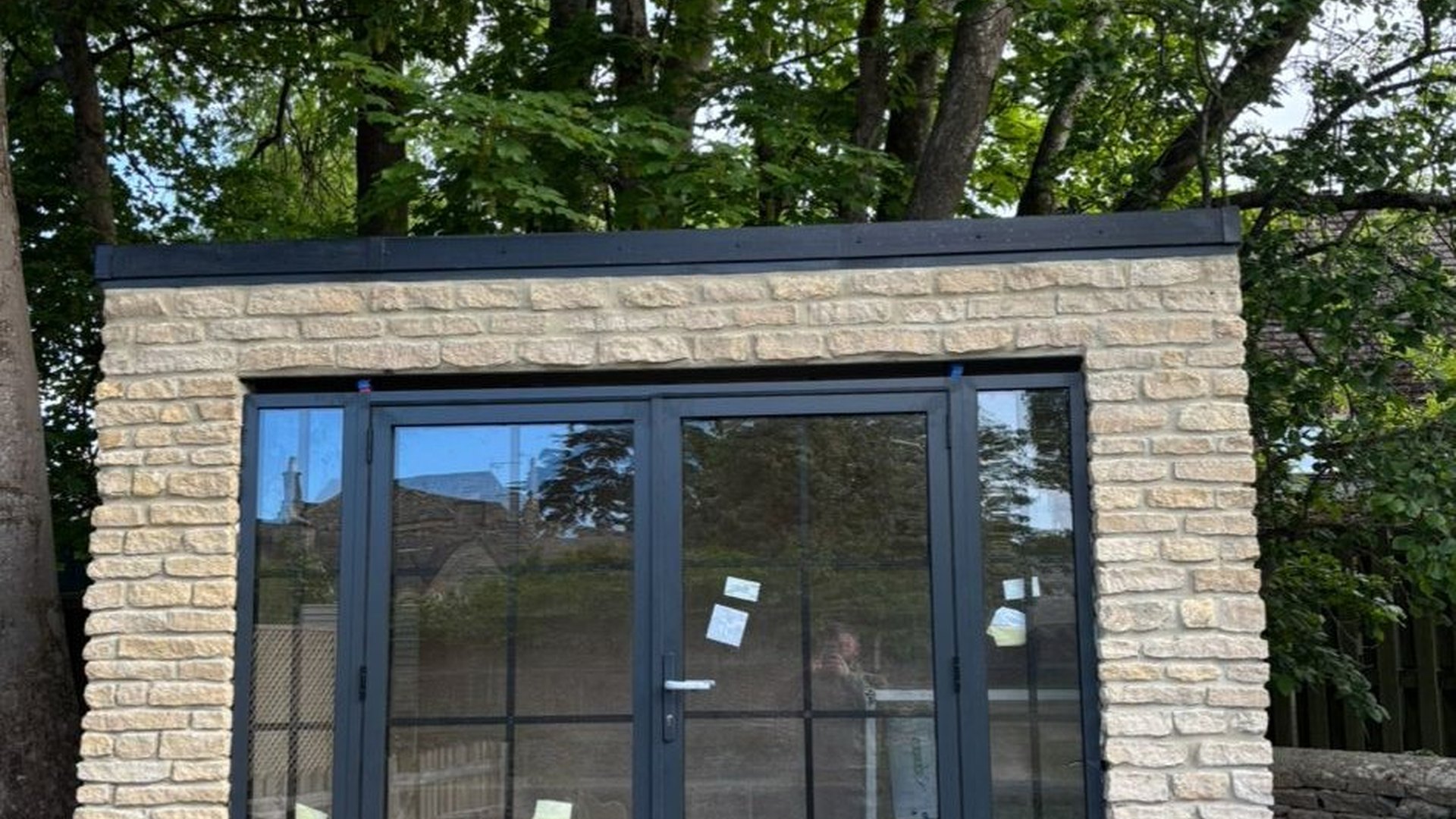 Finished stone garden room with glazed doors
