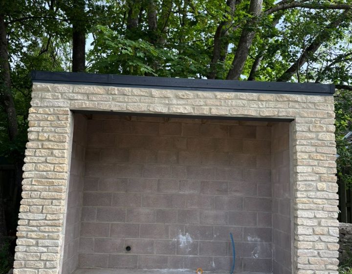 Blockwork garage opening finished in light stone