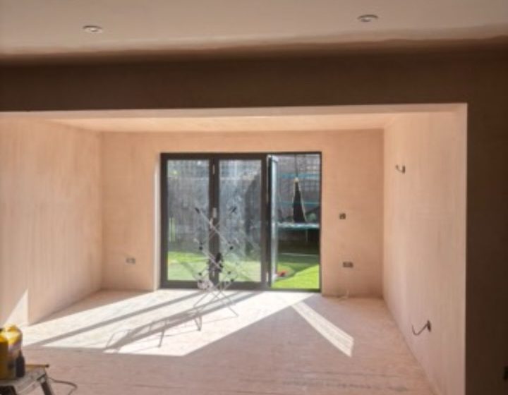 Interior renovation with bifold doors and fresh plasterboard