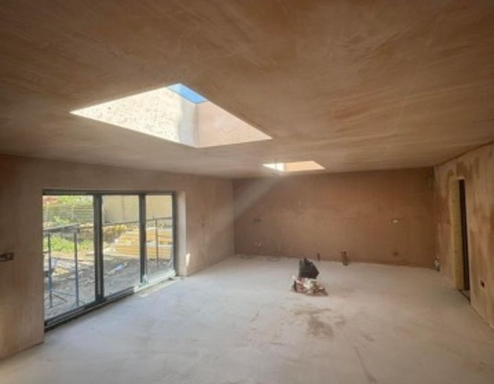 Plastered room renovation with rooflight and garden doors