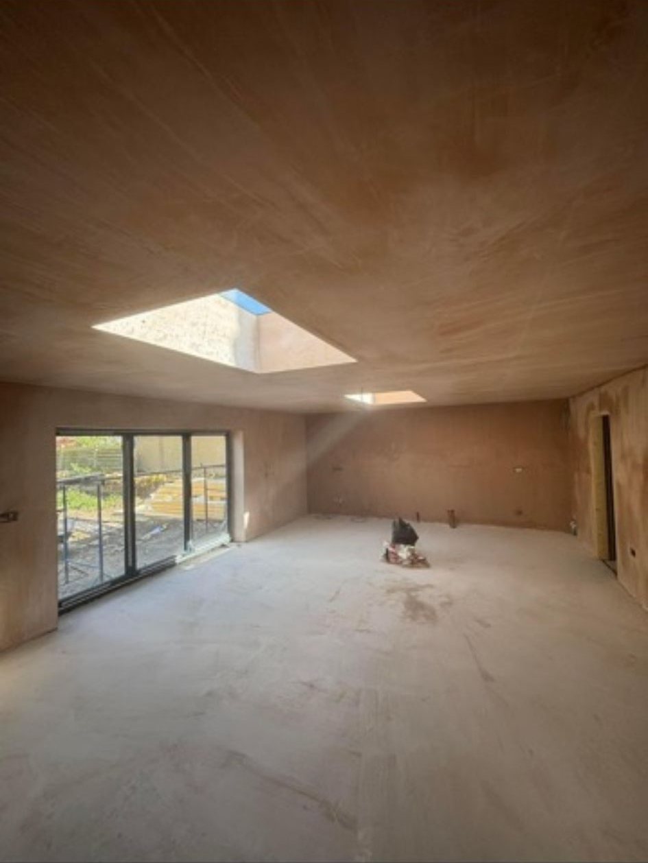 Plastered room renovation with rooflight and garden doors