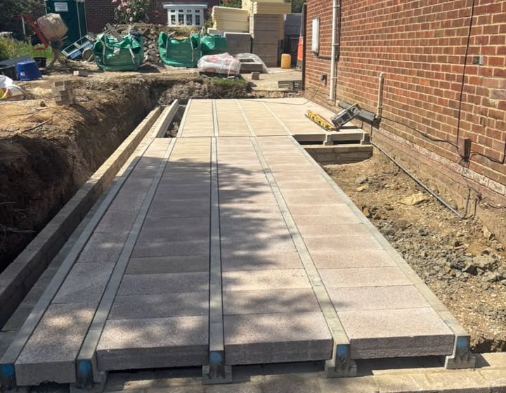 Beam-and-block floor installation for a home extension