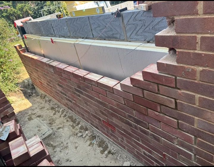Insulated cavity-wall brickwork detail during construction